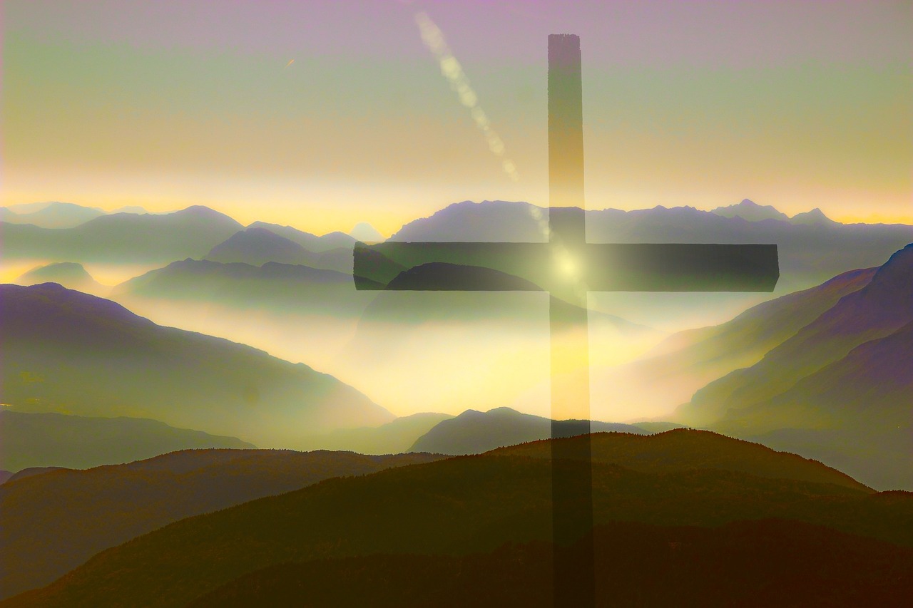 transparent cross against a mountain background